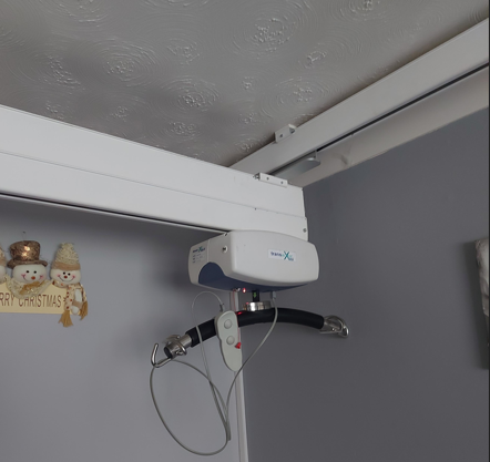 An example of a track hoist on a ceiling in a bedroom